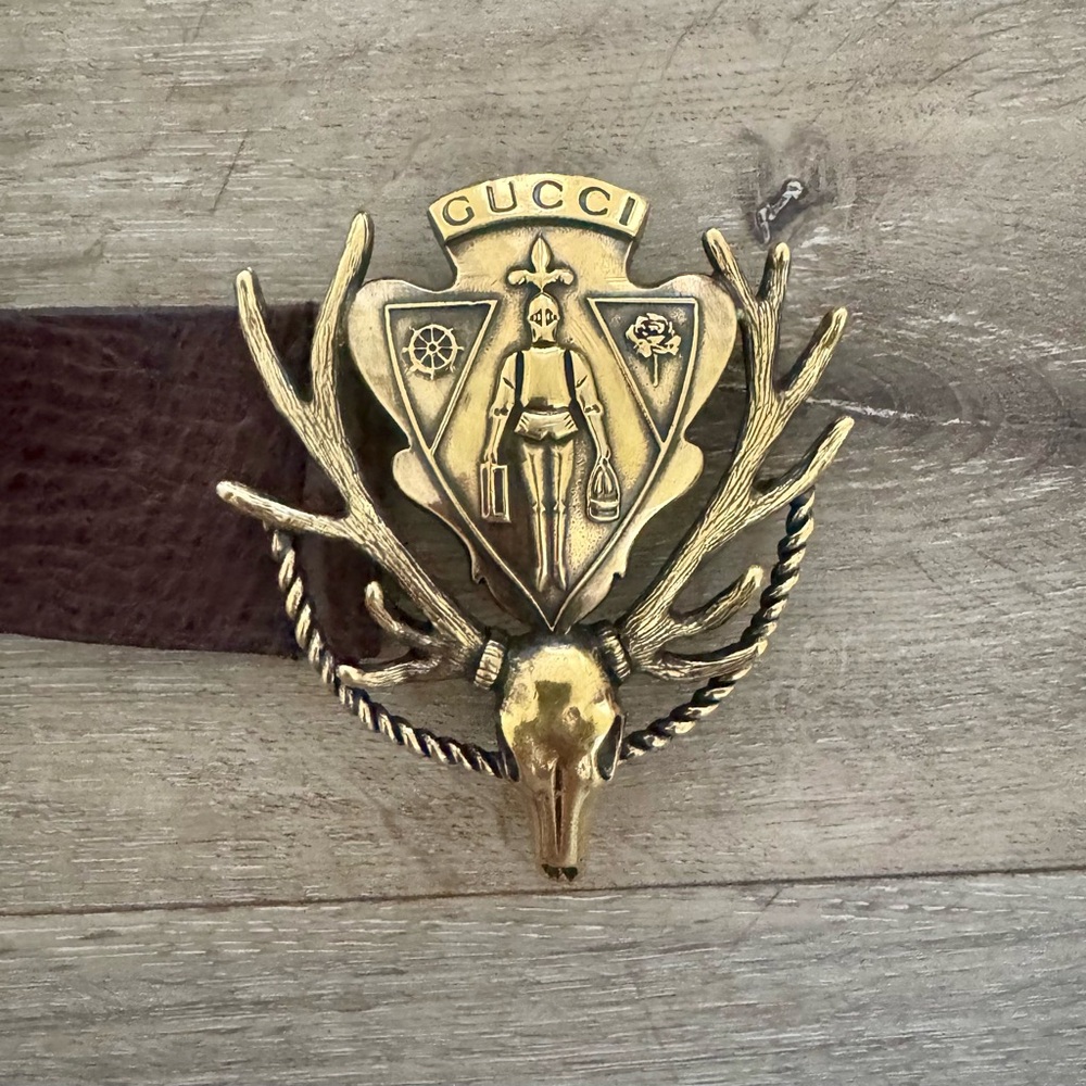 Authentic Gucci Dark Brown Belt with Antler Crest Symbol.